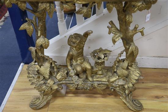 A Victorian carved giltwood and gesso jardinière table, child and trees underframe, W.83cm